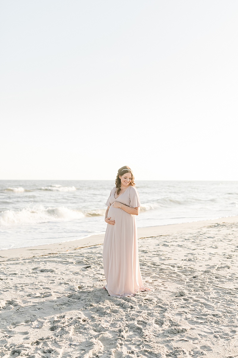 Sunset maternity session on Isle of Palms in Charleston, SC. Photos by Charleston Photographer, Caitlyn Motycka Photography.