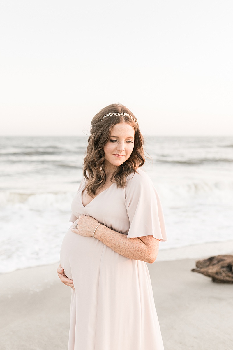Mama wearing a Show Me Your Mumu Emily gown for her sunny beach maternity session with Charleston Photographer, Caitlyn Motycka Photography.