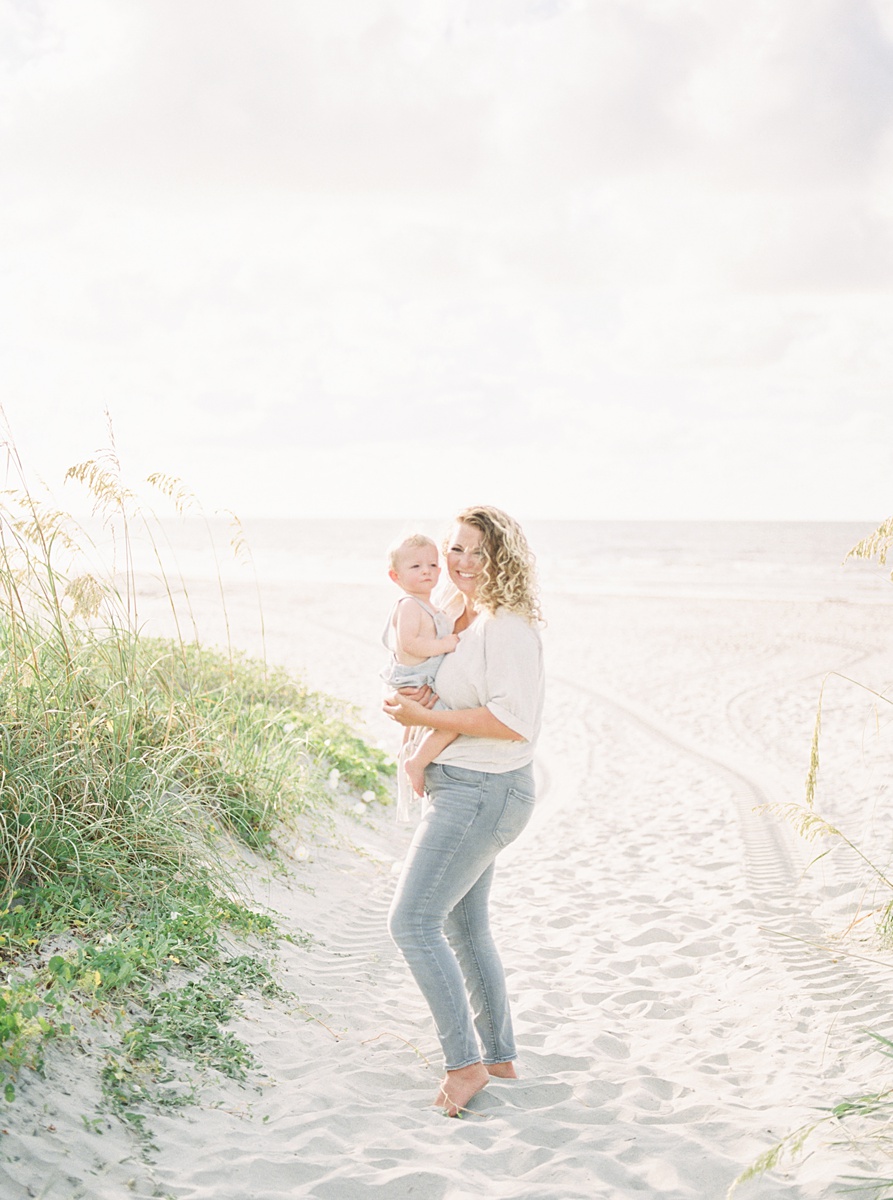 Mama and baby during their film photography family session on Folly Beach. Photos by Caitlyn Motycka Photography.