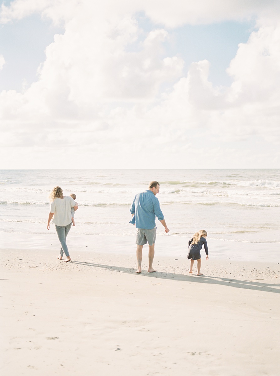 Family playing on the beach during sunrise film photoshoot at Folly Beach. Photos by Caitlyn Motycka Photography.