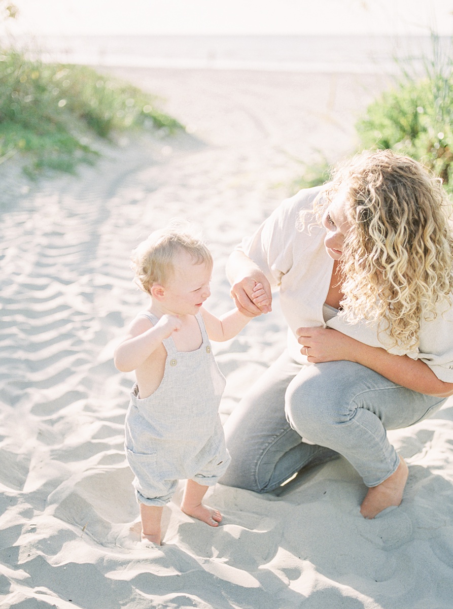 Mama and son during family photoshoot on Folly Beach. Photos by Charleston Film Photographer, Caitlyn Motycka Photography.