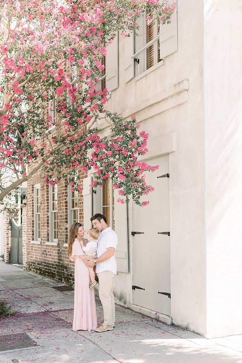 Downtown Charleston family photoshoot with Crepe Myrtles in bloom. Photos by Charleston Family Photographer, Caitlyn Motycka Photography.