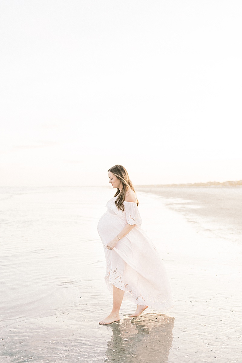 Maternity session on film at Isle of Palms. Mama is wearing a fillyboo maternity dress. Photos by Charleston Film Photographer, Caitlyn Motycka Photography.