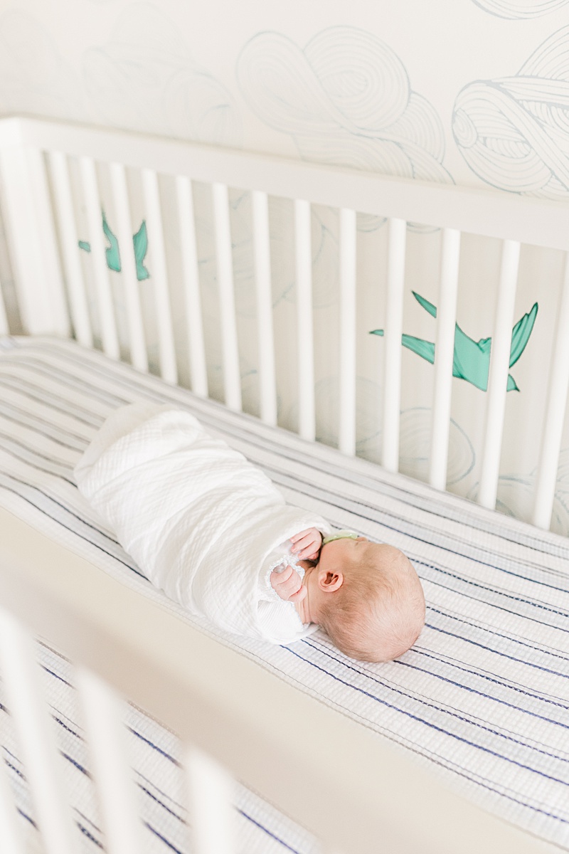 Baby boy swaddled in his crib. Photos by Daniel Island Newborn Photographer, Caitlyn Motycka Photography.