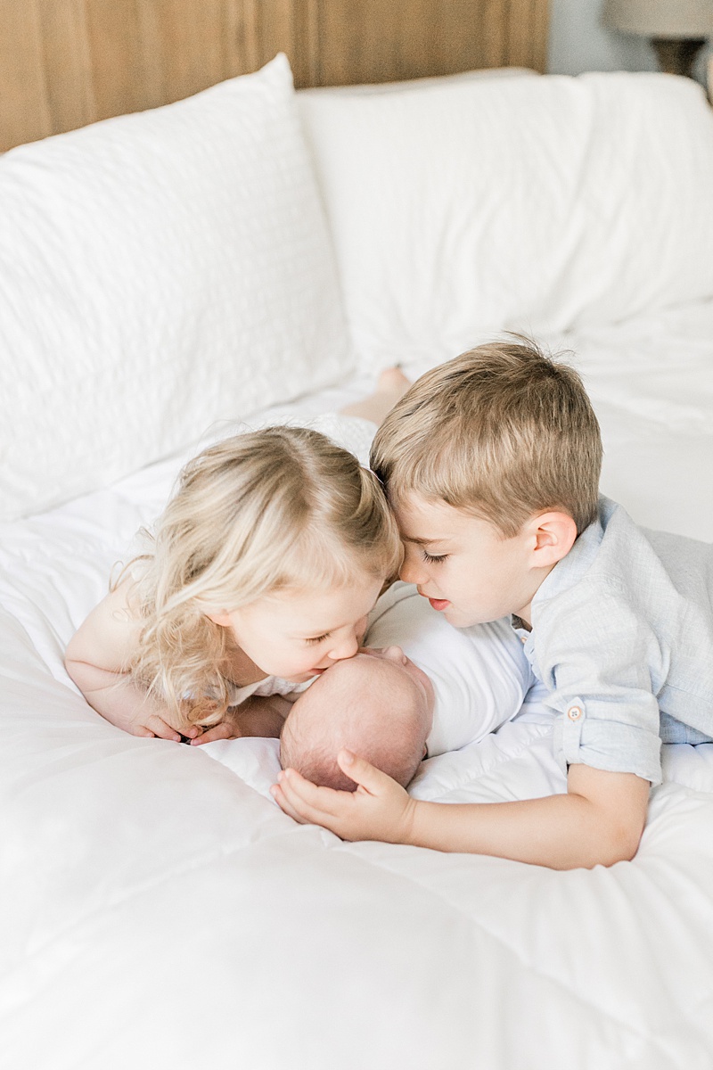 Mount Pleasant Newborn Photographer takes photos of siblings in client's home. Photos by Caitlyn Motycka Photography. 