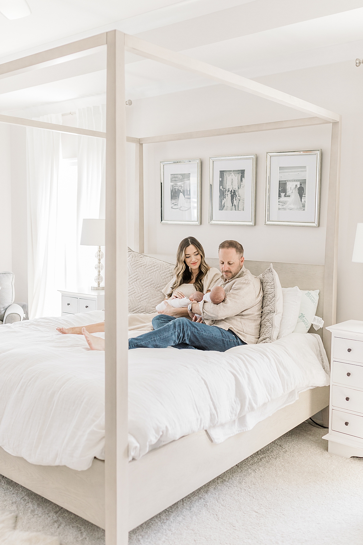 Newborn photos in master bedroom in beautiful Charleston home. Photos by Caitlyn Motycka Photography.