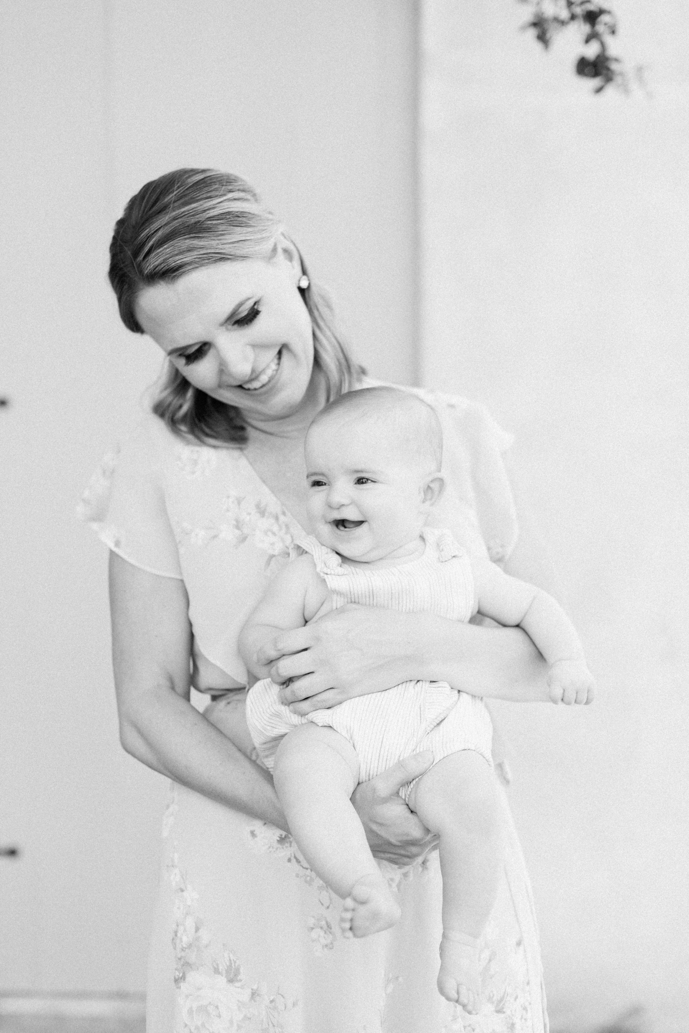 Black and white motherhood image by Charleston Family Photographer, Caitlyn Motycka Photography.