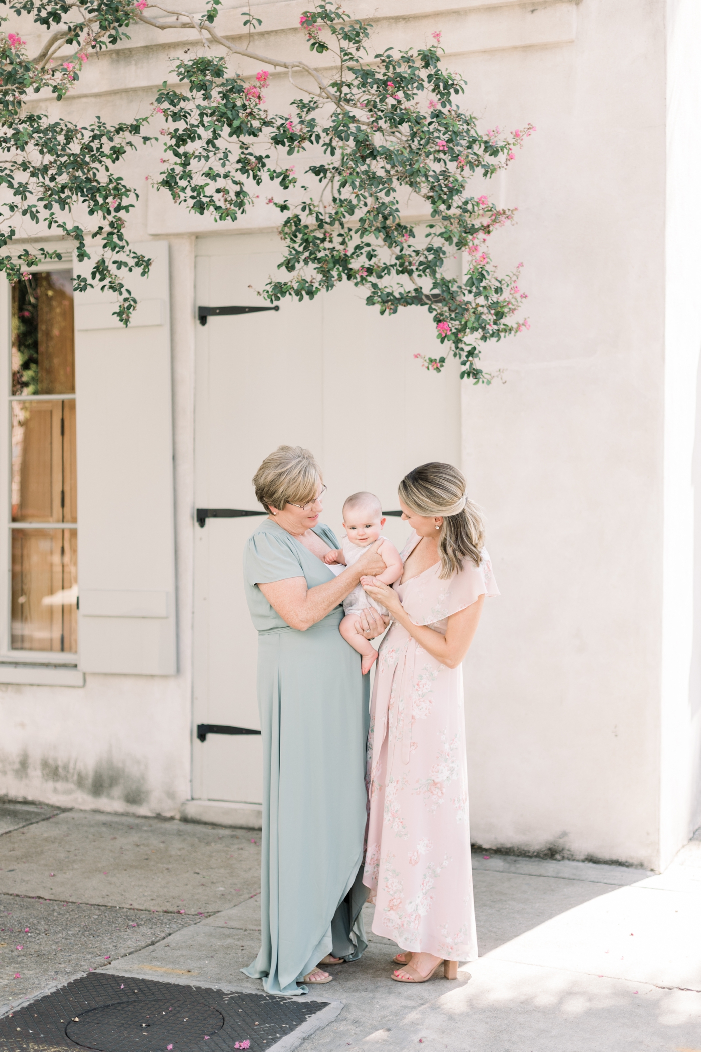 Grandma with daughter and granddaughter in motherhood mini session. Photo by Caitlyn Motycka Photography.