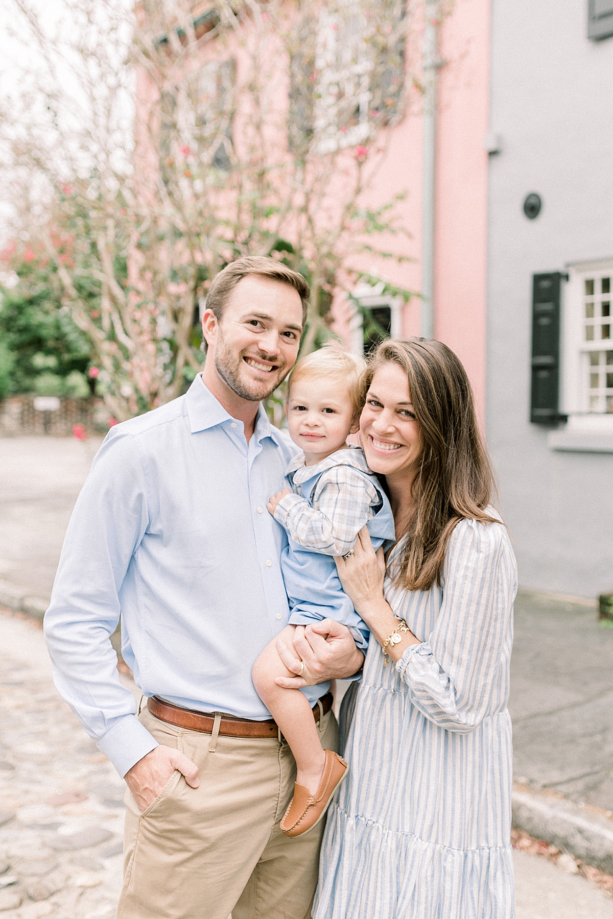 Family Photographer in Charleston, SC photographs family along the historic cobblestone streets while strolling through Downtown! Photos by Caitlyn Motycka Photography.