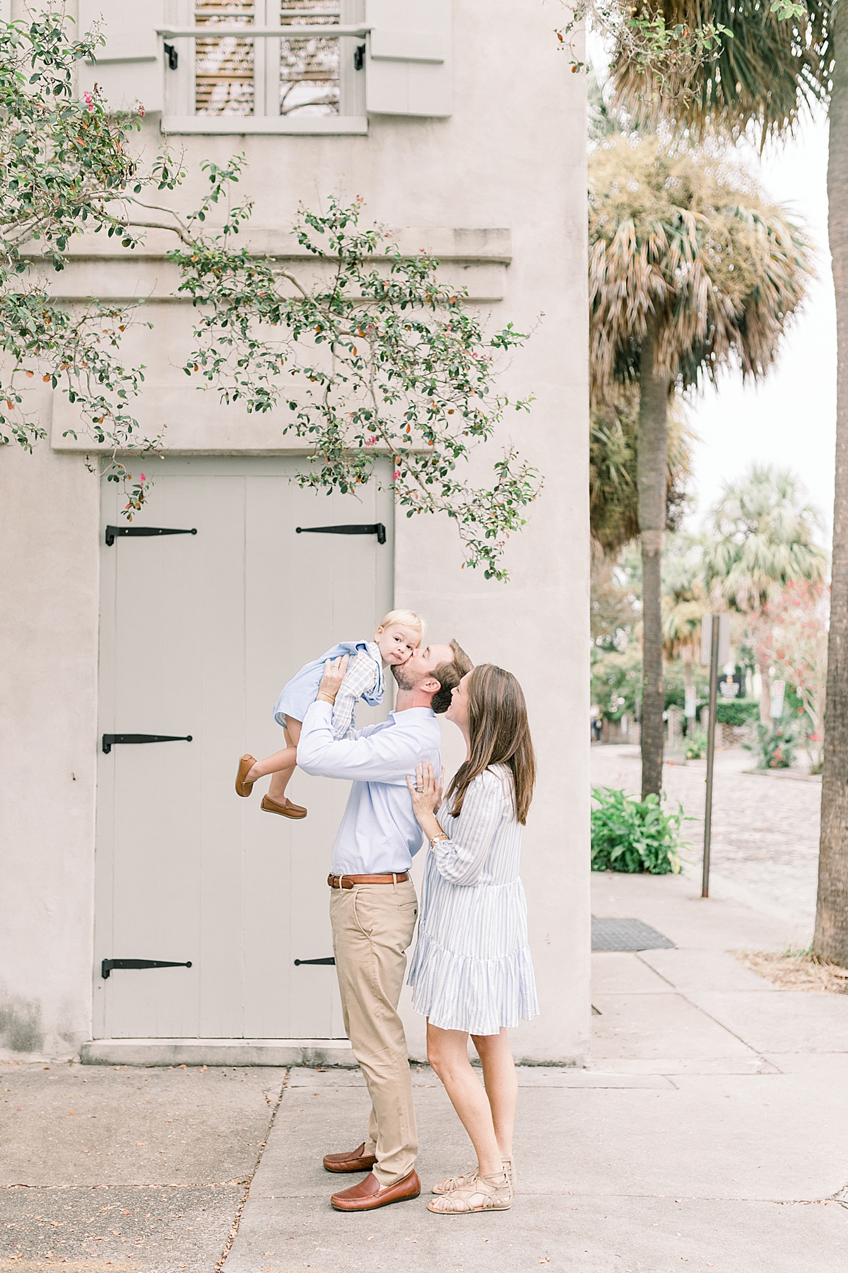 Dad kissing son during family session with Charleston Photographer, Caitlyn Motycka Photography.