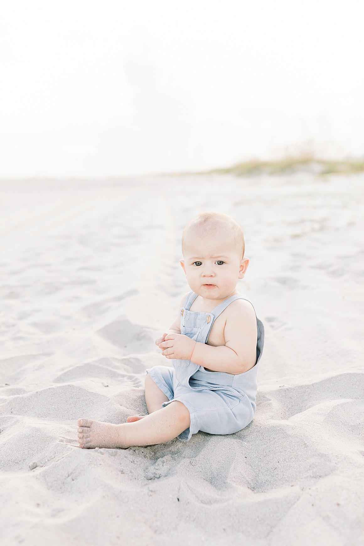 Little boy turns one and celebrates with a beach photoshoot in Charleston, SC. Photos by Caitlyn Motycka Photography