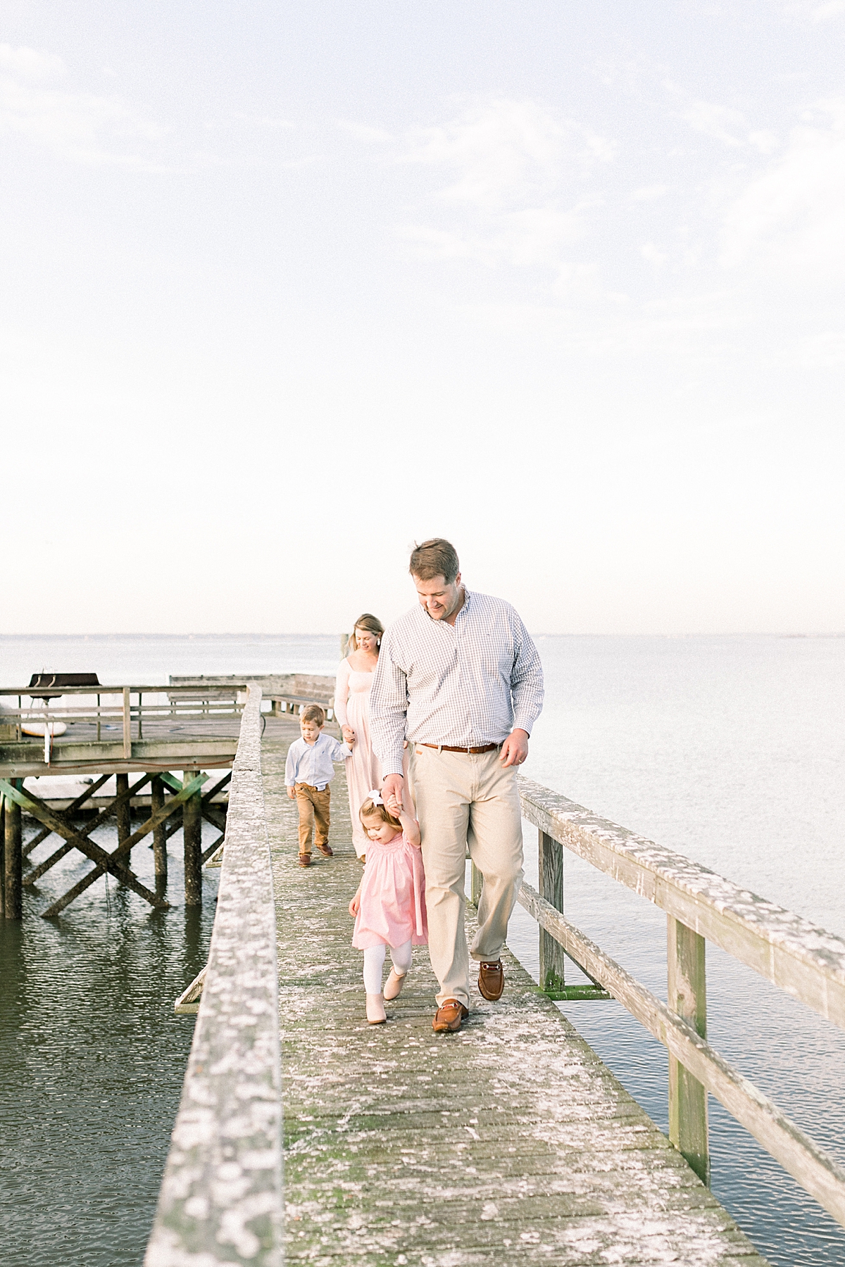 Family photoshoot on dock in the Old Village district of Mount Pleasant. Photos by Caitlyn Motycka Photography.