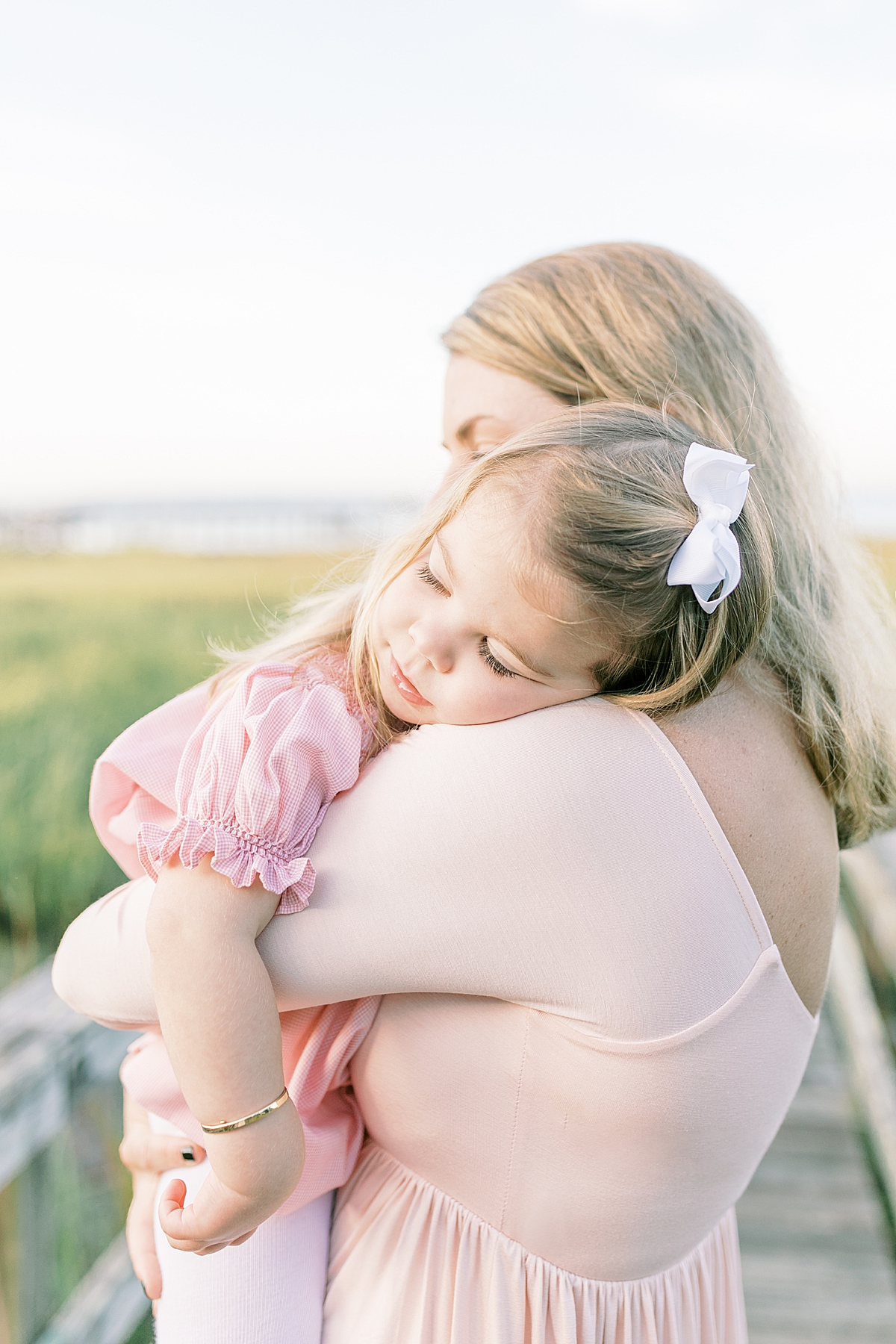Sweet moment of Mom and daughter during family session with Charleston Photographer, Caitlyn Motycka Photography.
