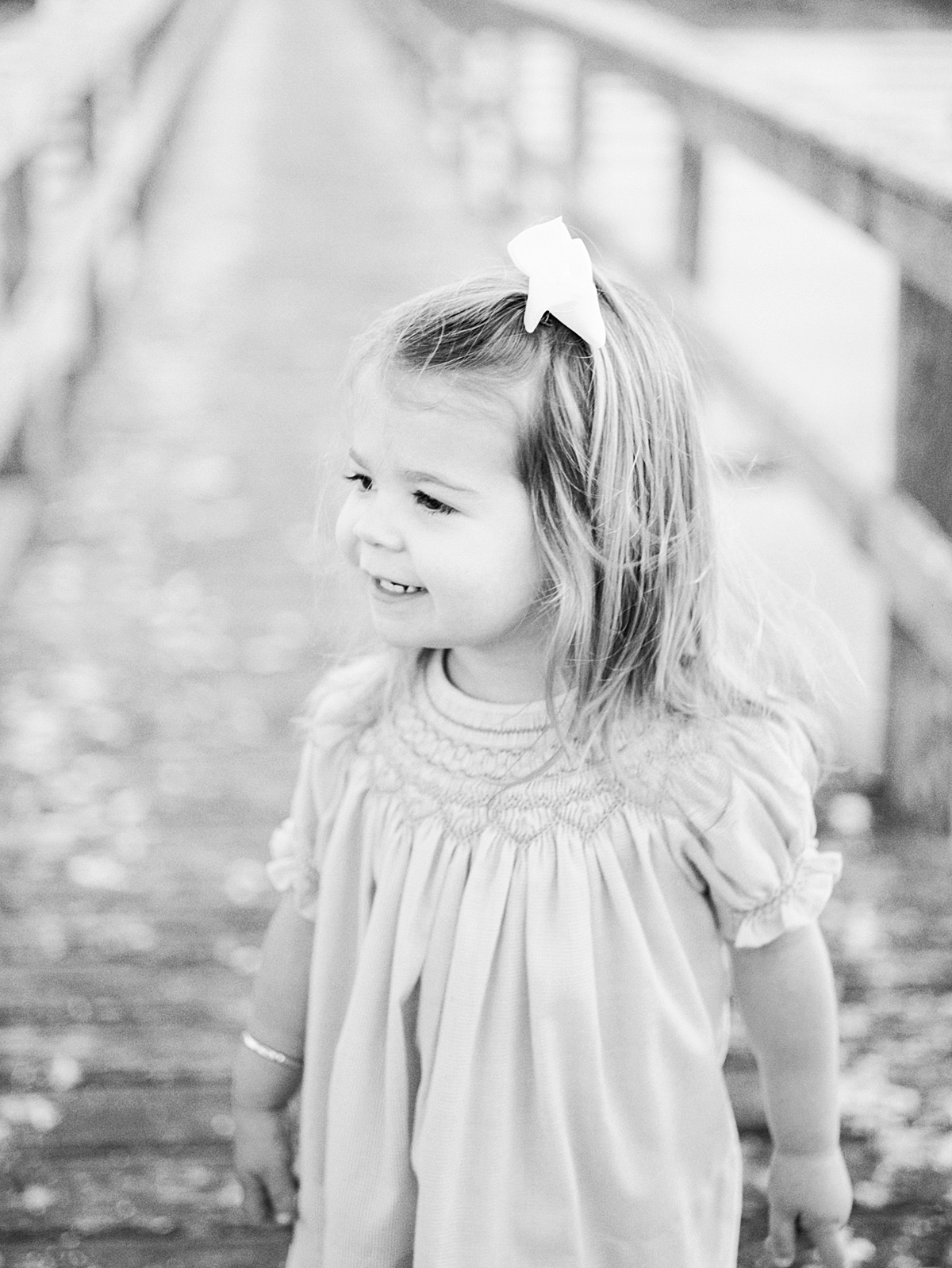 Black and white photo of young girl during family photoshoot with Caitlyn Motycka Photography.