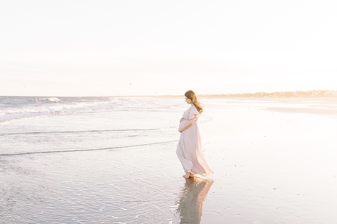 Golden hour sunset maternity session on Isle of Palms Beach in Charleston, SC. Photos by Caitlyn Motycka Photography.