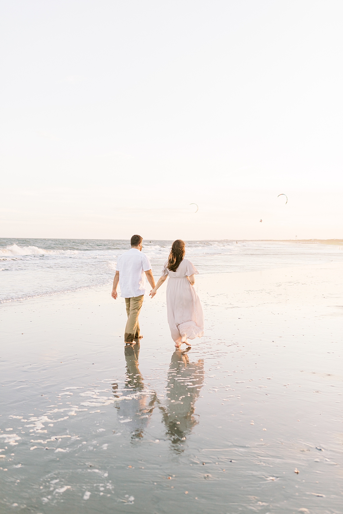 Golden hour sunset maternity session in Charleston, SC on Isle of Palms. Photos by Caitlyn Motycka Photography.