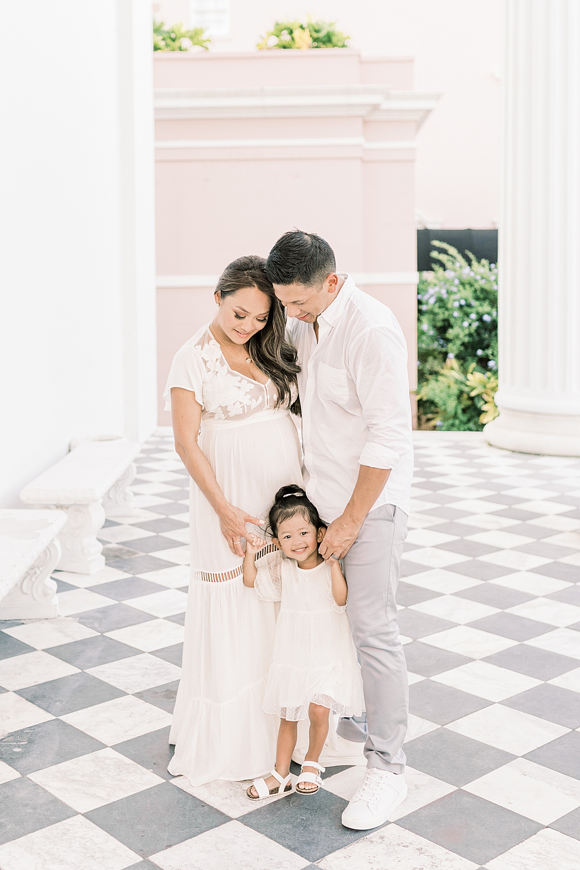 Downtown Charleston Photoshoot to celebrate pregnancy for family. Photos by Caitlyn Motycka Photography.