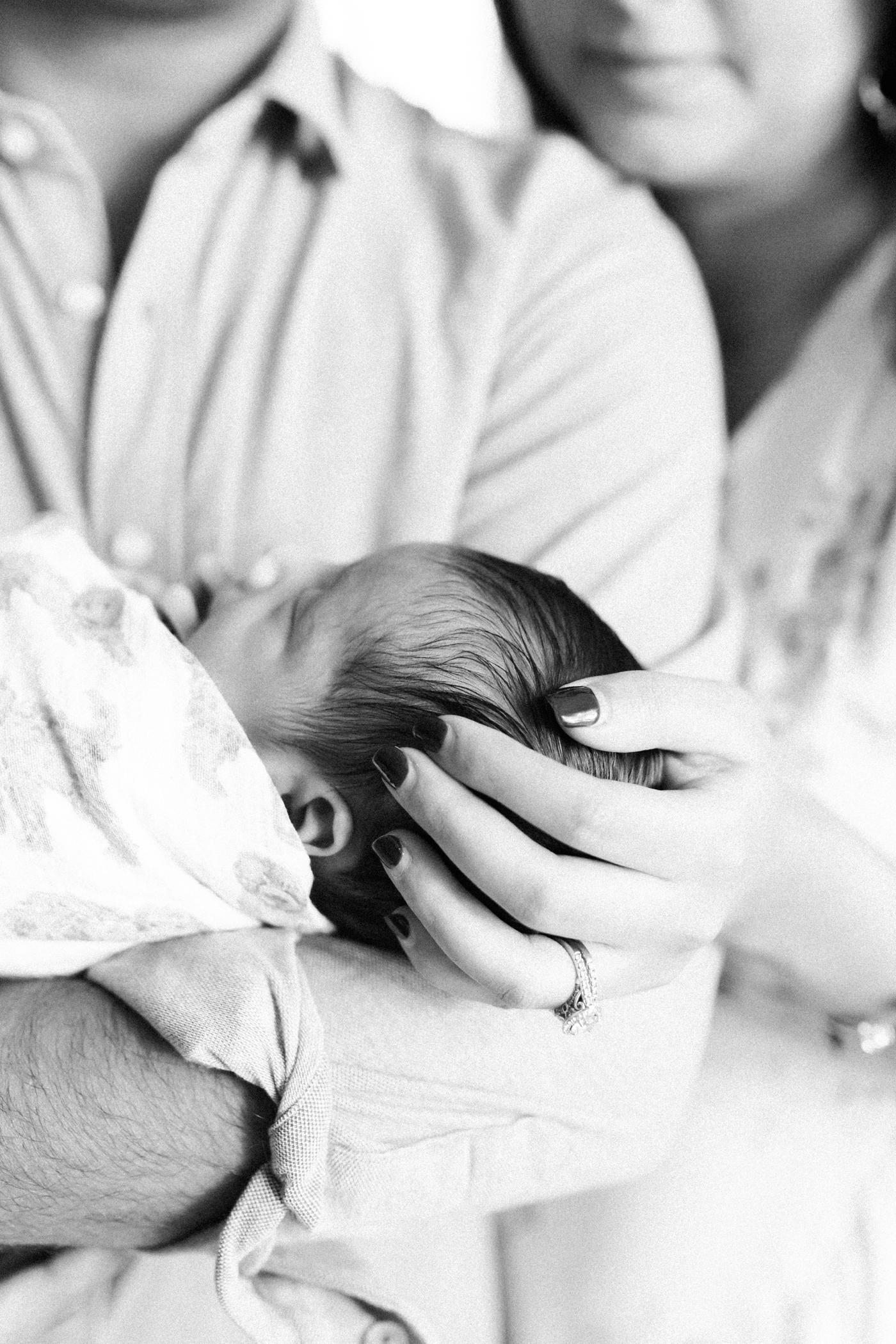 Black and white detail photo during lifestyle newborn photoshoot with Charleston Photographer, Caitlyn Motycka Photography. 