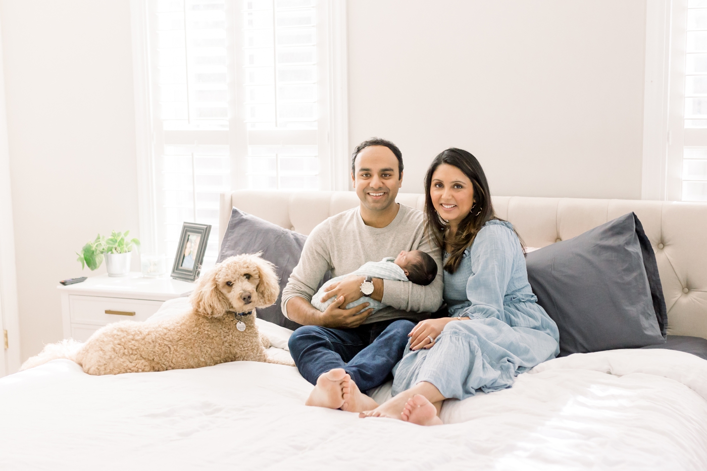 In-home newborn session including the family's dog. Photo by Caitlyn Motycka Photography.