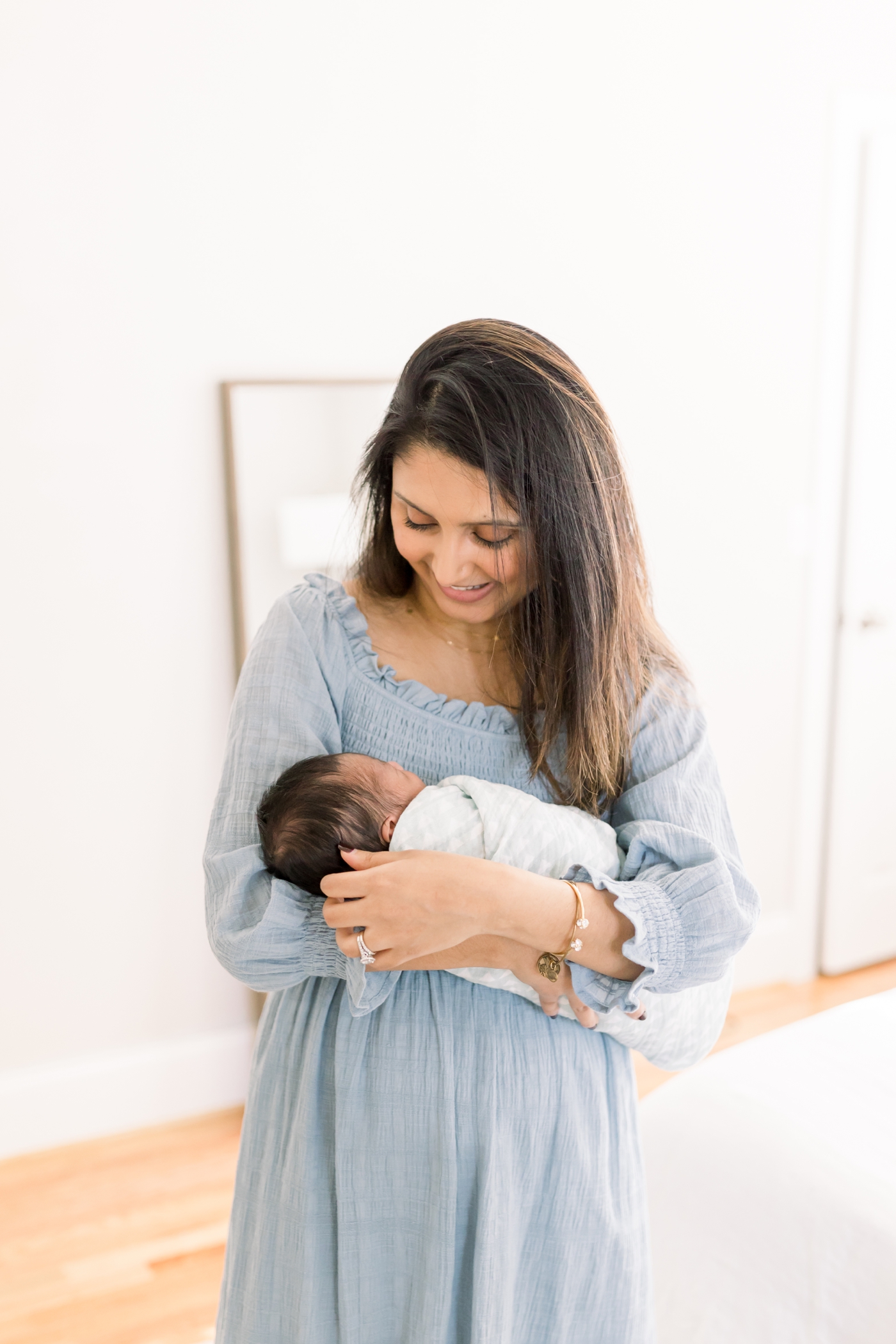 Mother and son photo in Charleston home during lifestyle newborn session. Photo by Caitlyn Motycka Photography.