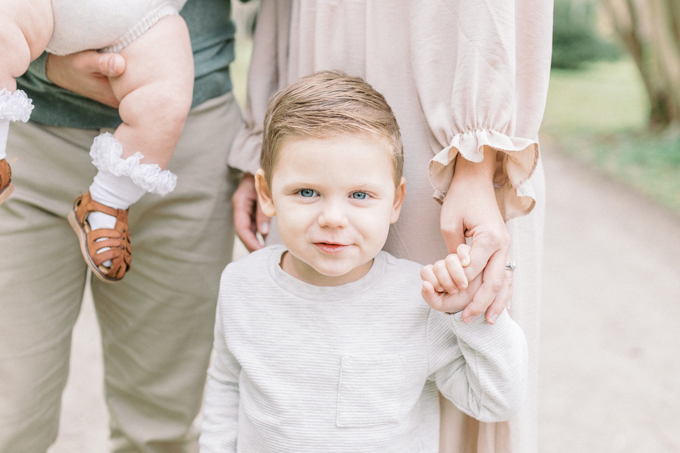 Closeup of toddler boy during family session. Photo by Caitlyn Motycka Photography.