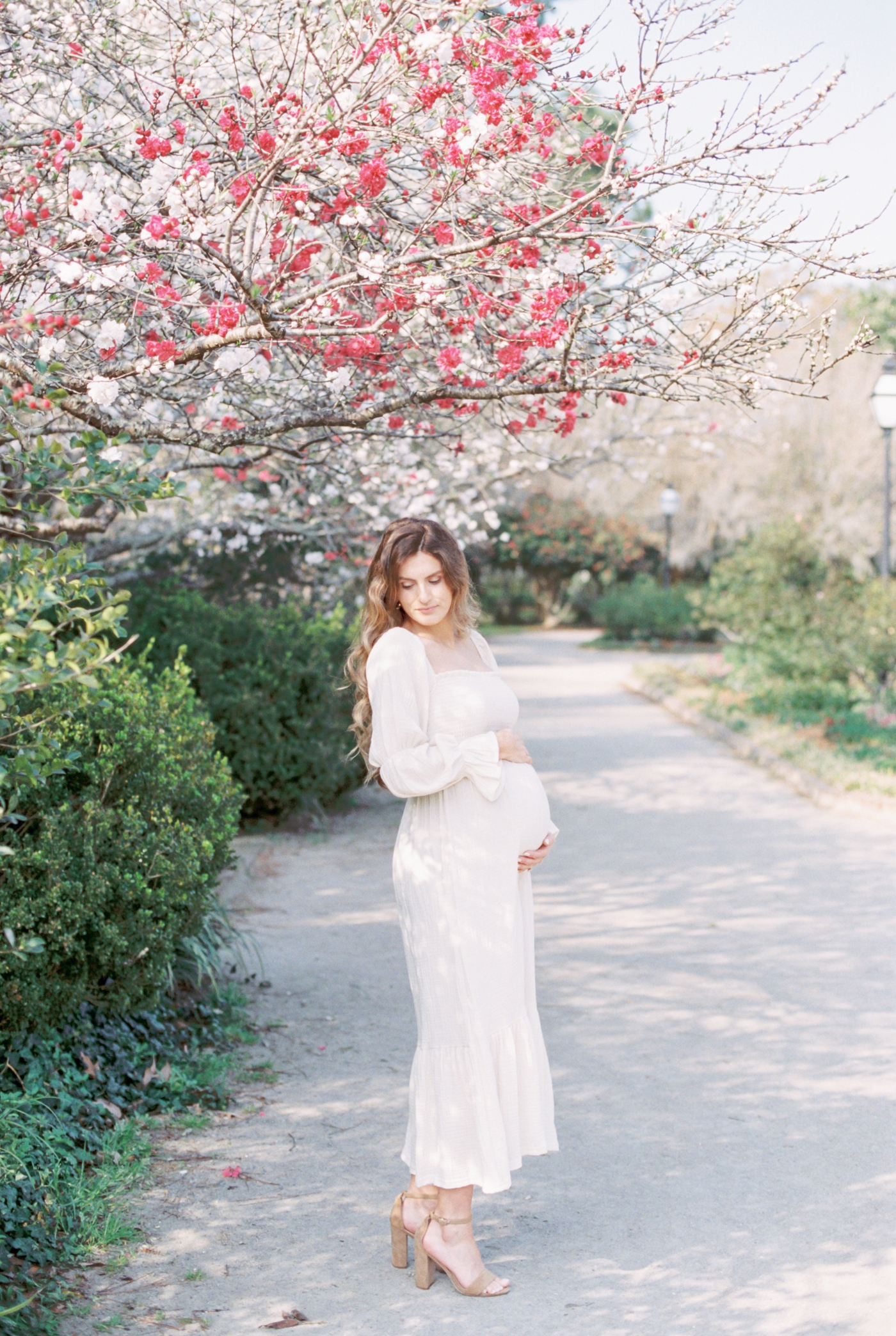 Pregnant woman photographed on Fuji400h film by fine art maternity photographer, Caitlyn Motycka Photography.