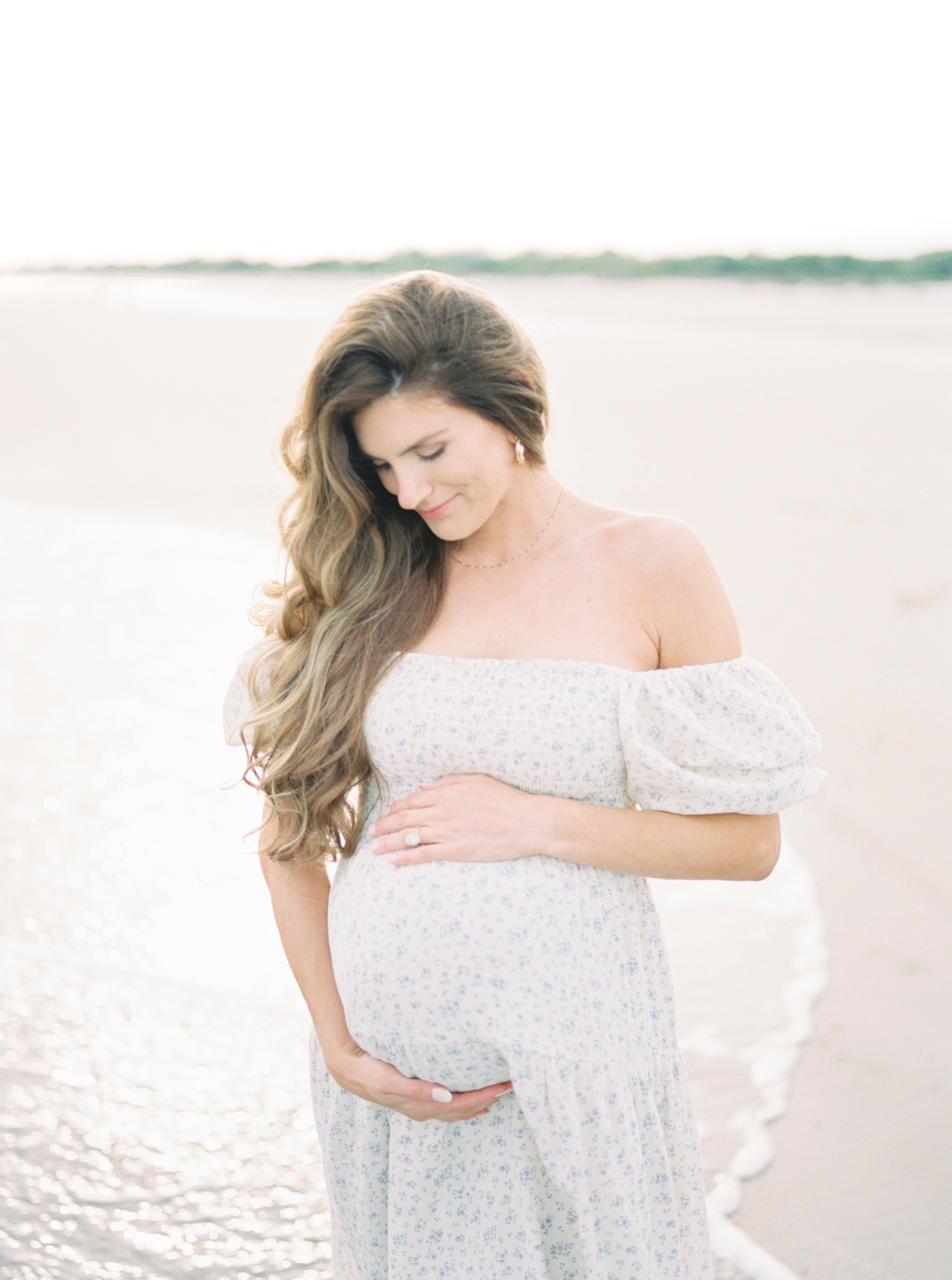 Expectant mother on the beach at Sullivans Island | Photo by Caitlyn Motycka Photography.