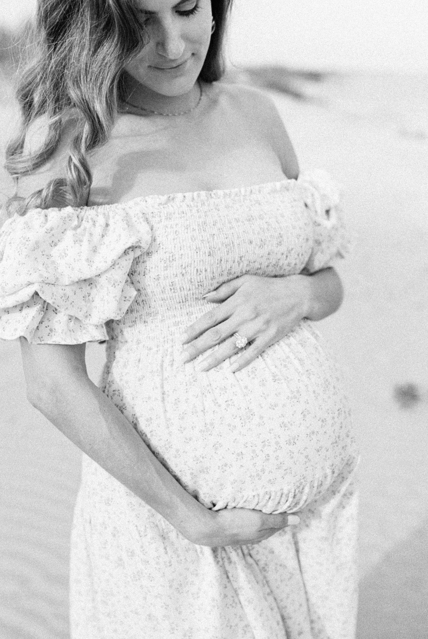 Black and white maternity photo on Sullivans Island | Photo by Caitlyn Motycka Photography.