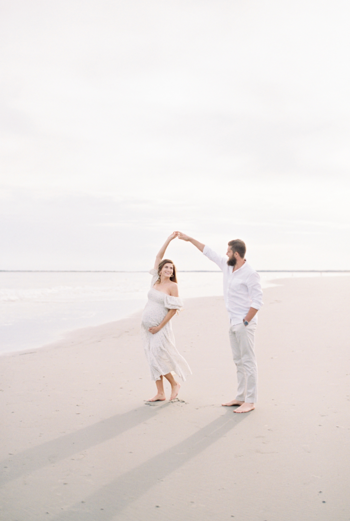 Film Images of couple dancing on the beach | Photo by Caitlyn Motycka Photography.