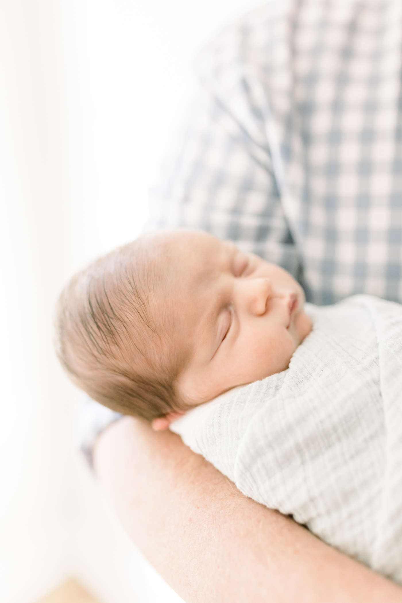 Detail of sleeping newborn during an in home session | Photo by Caitlyn Motycka Photography.