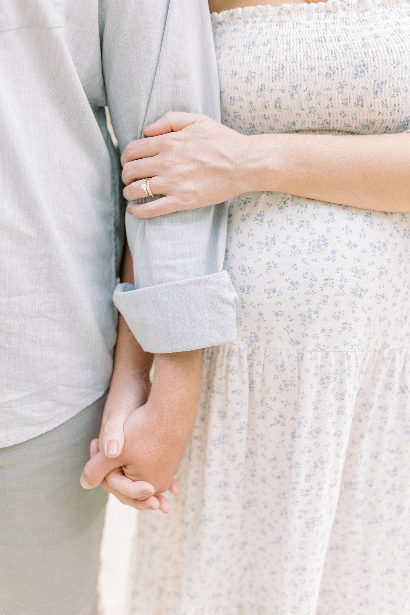 Detail photo of mom's ring holding dad's arm | Photo by Caitlyn Motycka Photography.