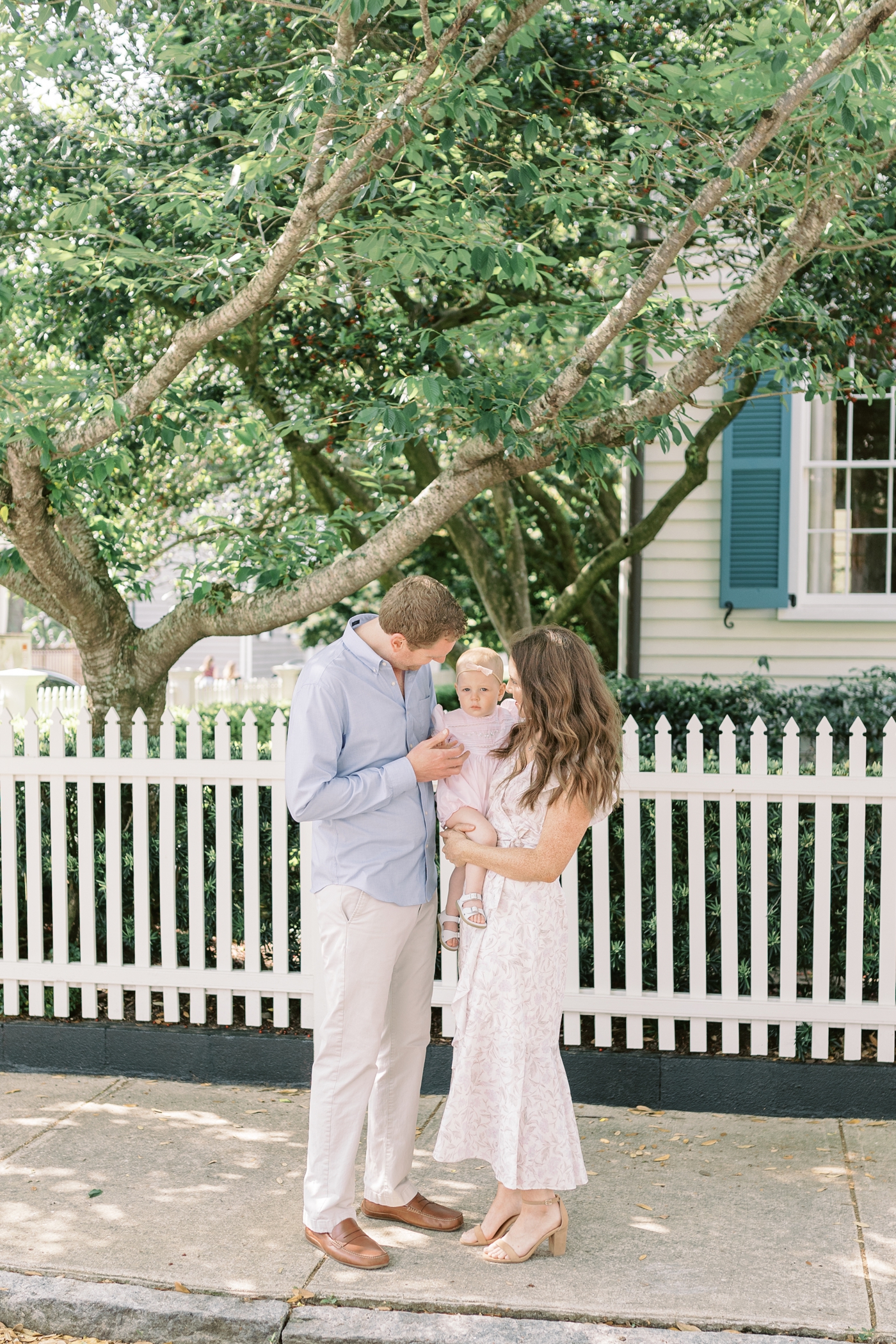 Family walking downtown Charleston with baby girl | Photo by Caitlyn Motycka Photography.