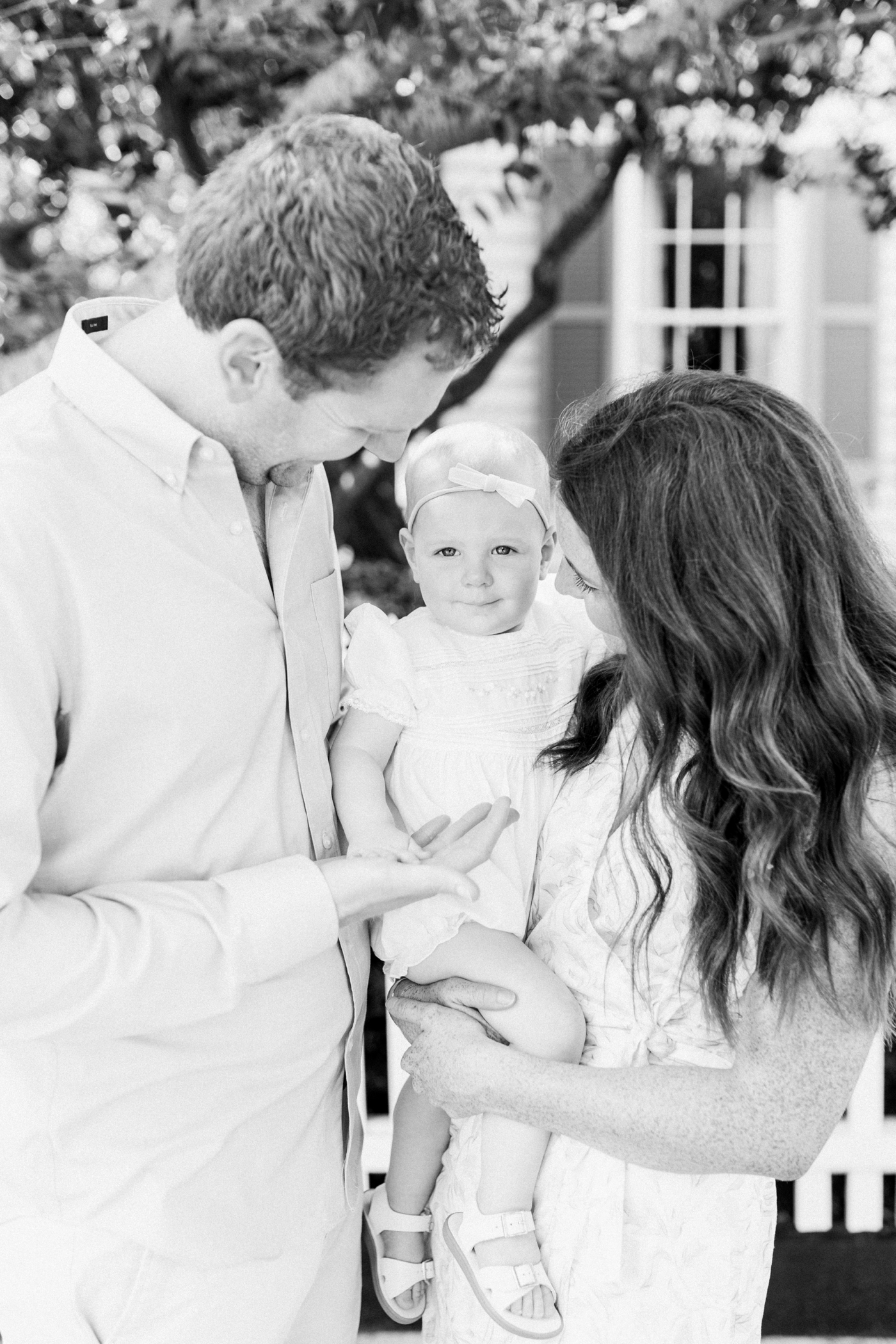 Black and white film photo of family in downtown Charleston 18 month session | Photo by Caitlyn Motycka Photography.