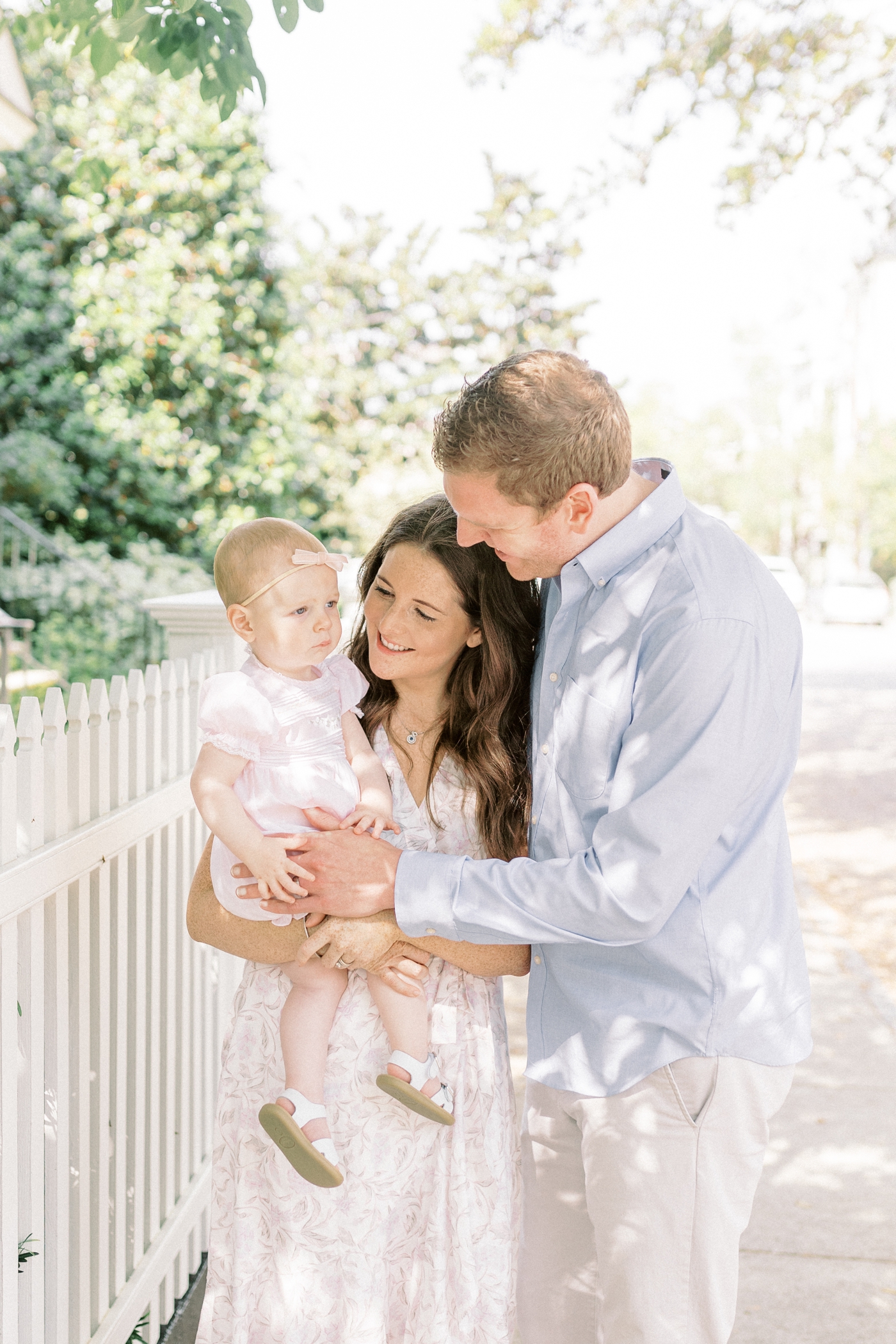 Family snuggled together during family photo session | Photo by Caitlyn Motycka Photography.