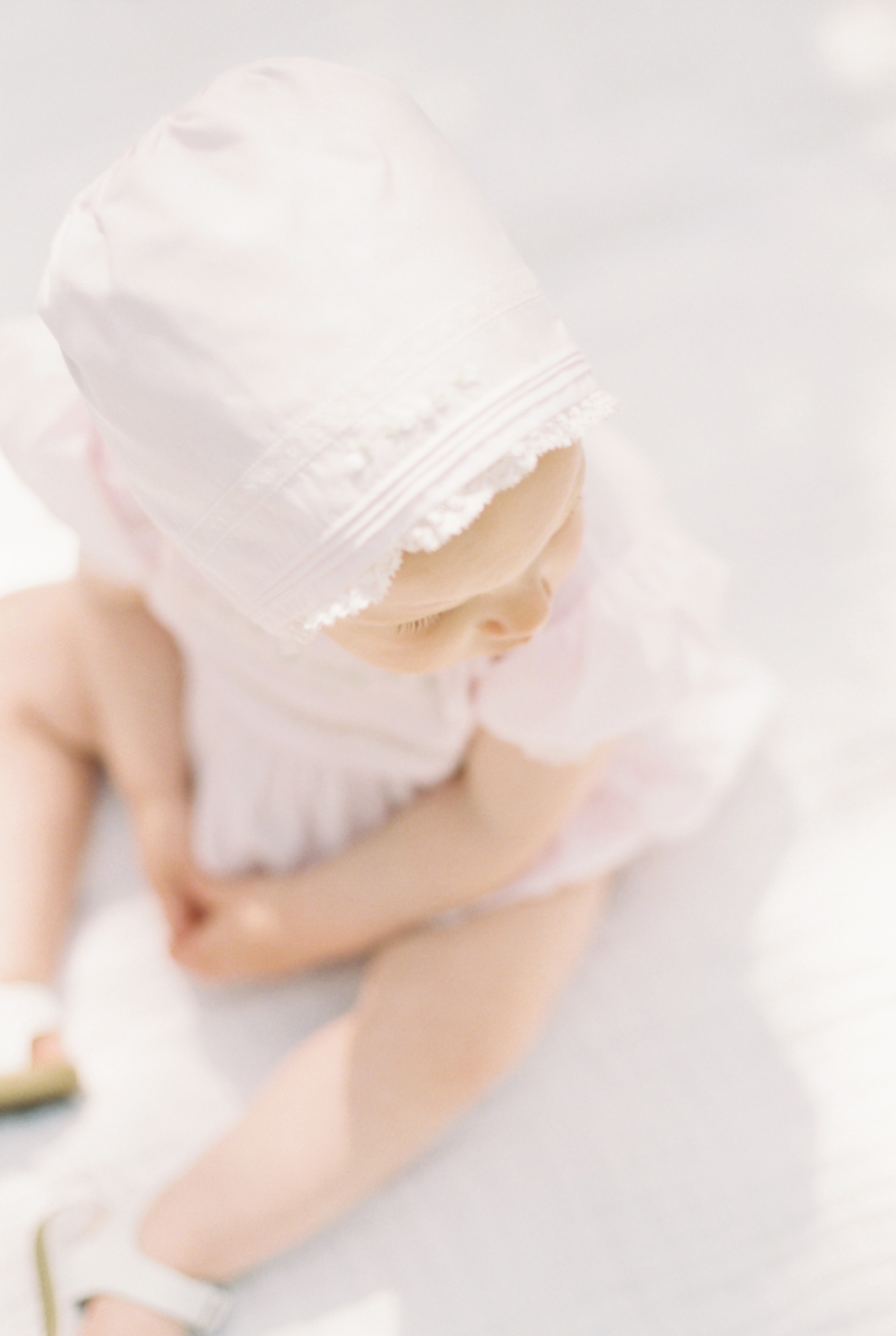Details of baby's pink bonnet downtown charleston | Photo by Caitlyn Motycka Photography.