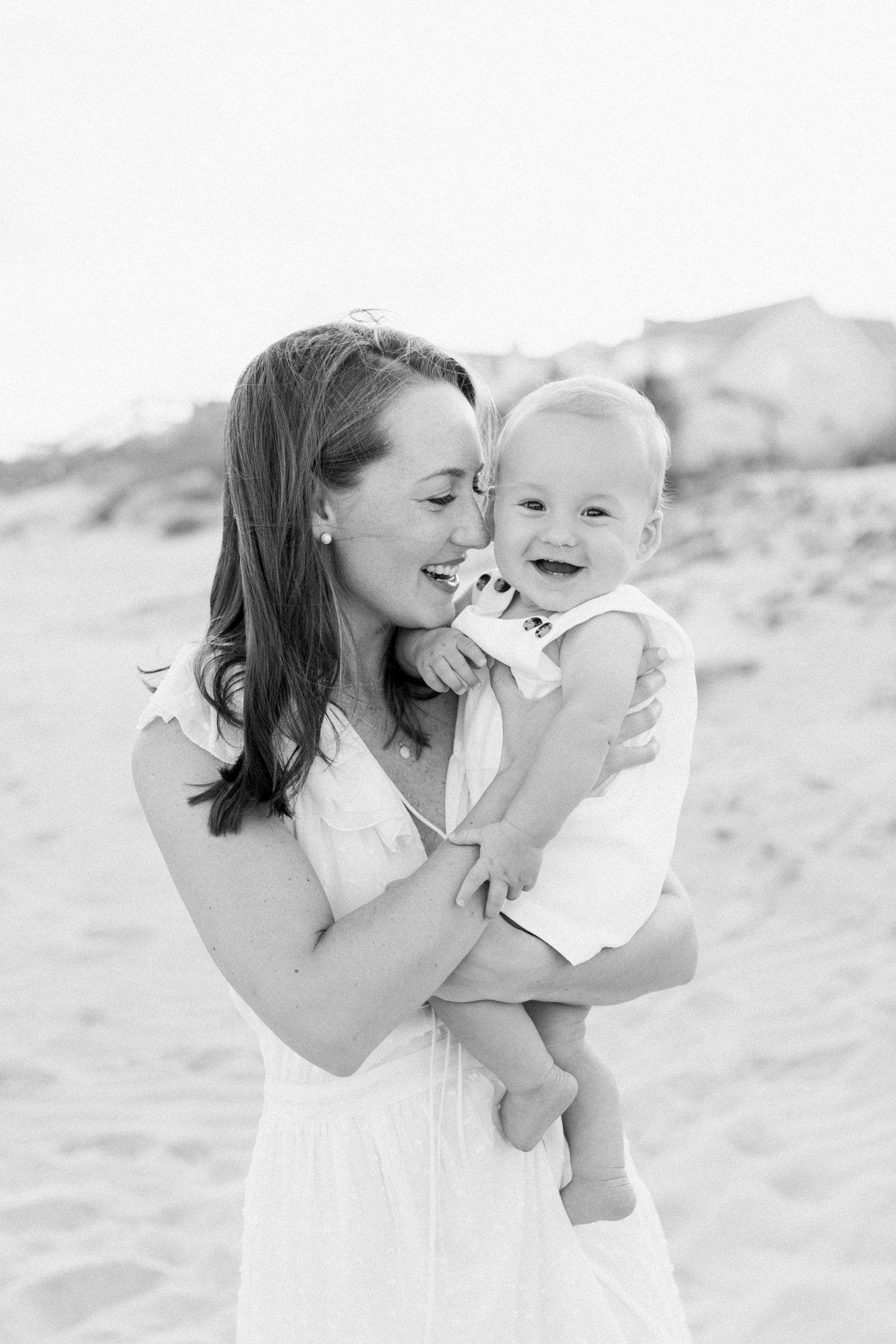 Black and white photo of mom snuggling her baby boy | Photo by Caitlyn Motycka Photography.