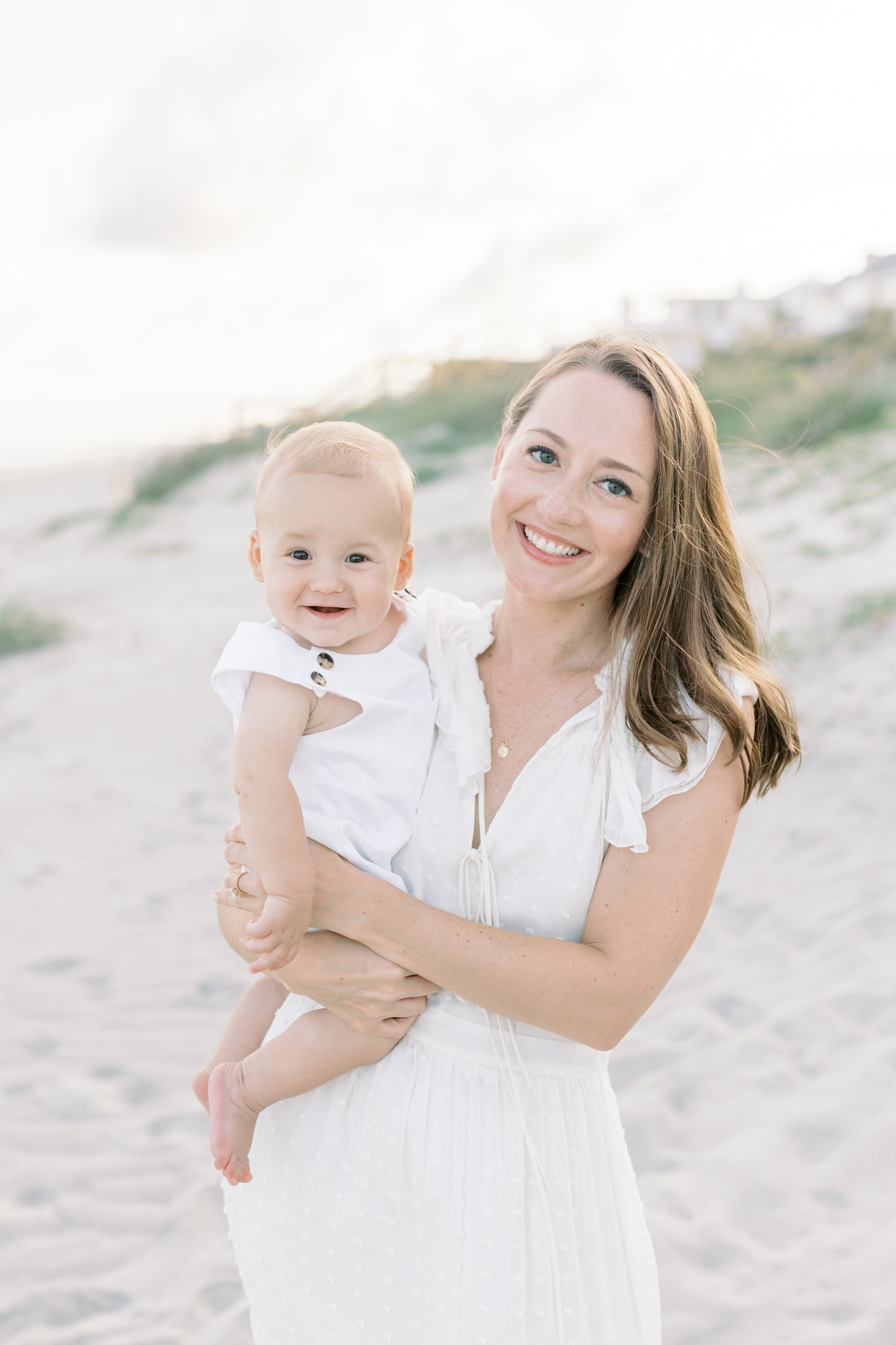 Mom holding her baby boy on the beach at IOP | Photo by Caitlyn Motycka Photography.