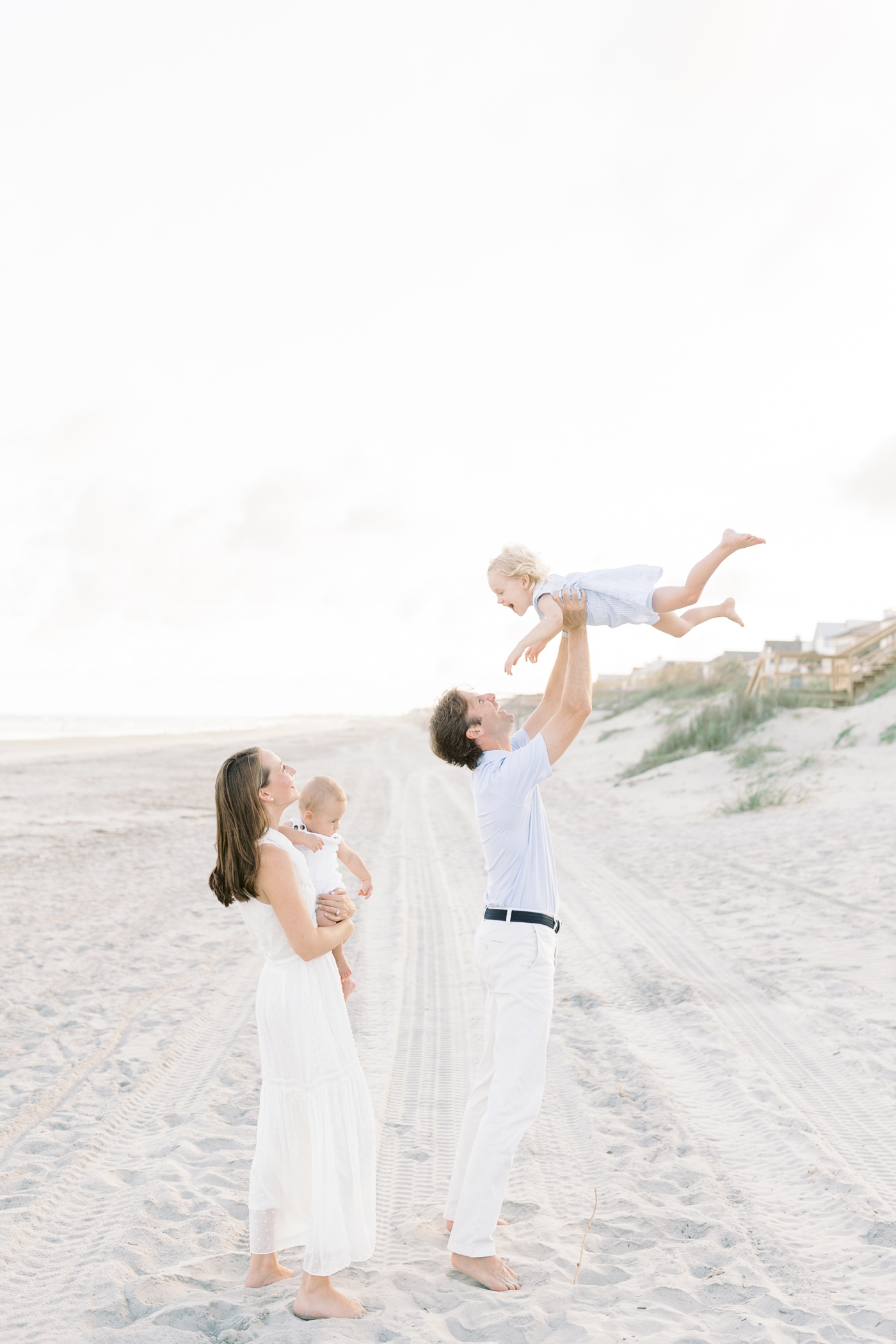 Family playing on the beach at Isle of Palms | Photo by Caitlyn Motycka Photography.