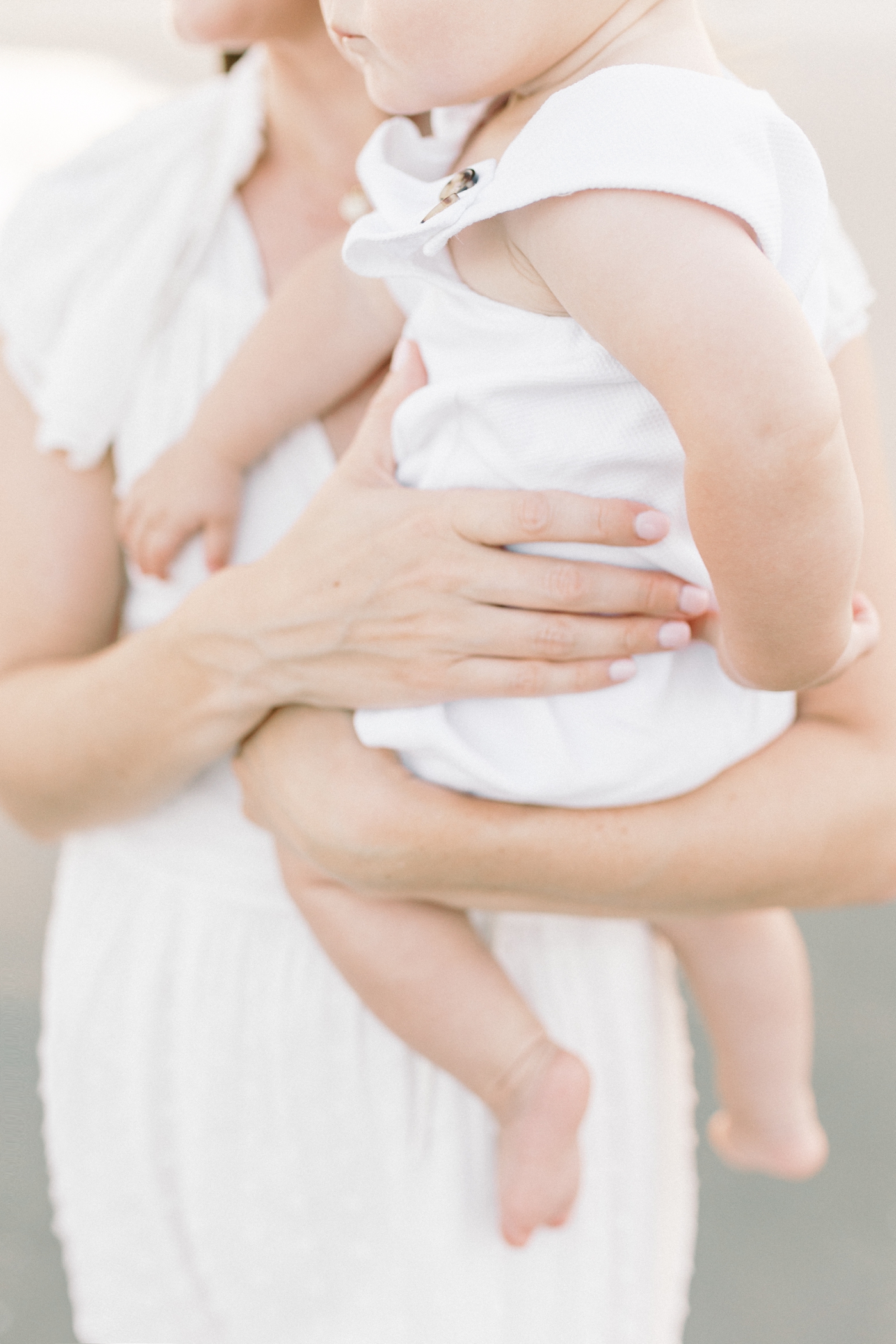 Detail of baby boy held by mom | Photo by Caitlyn Motycka Photography.