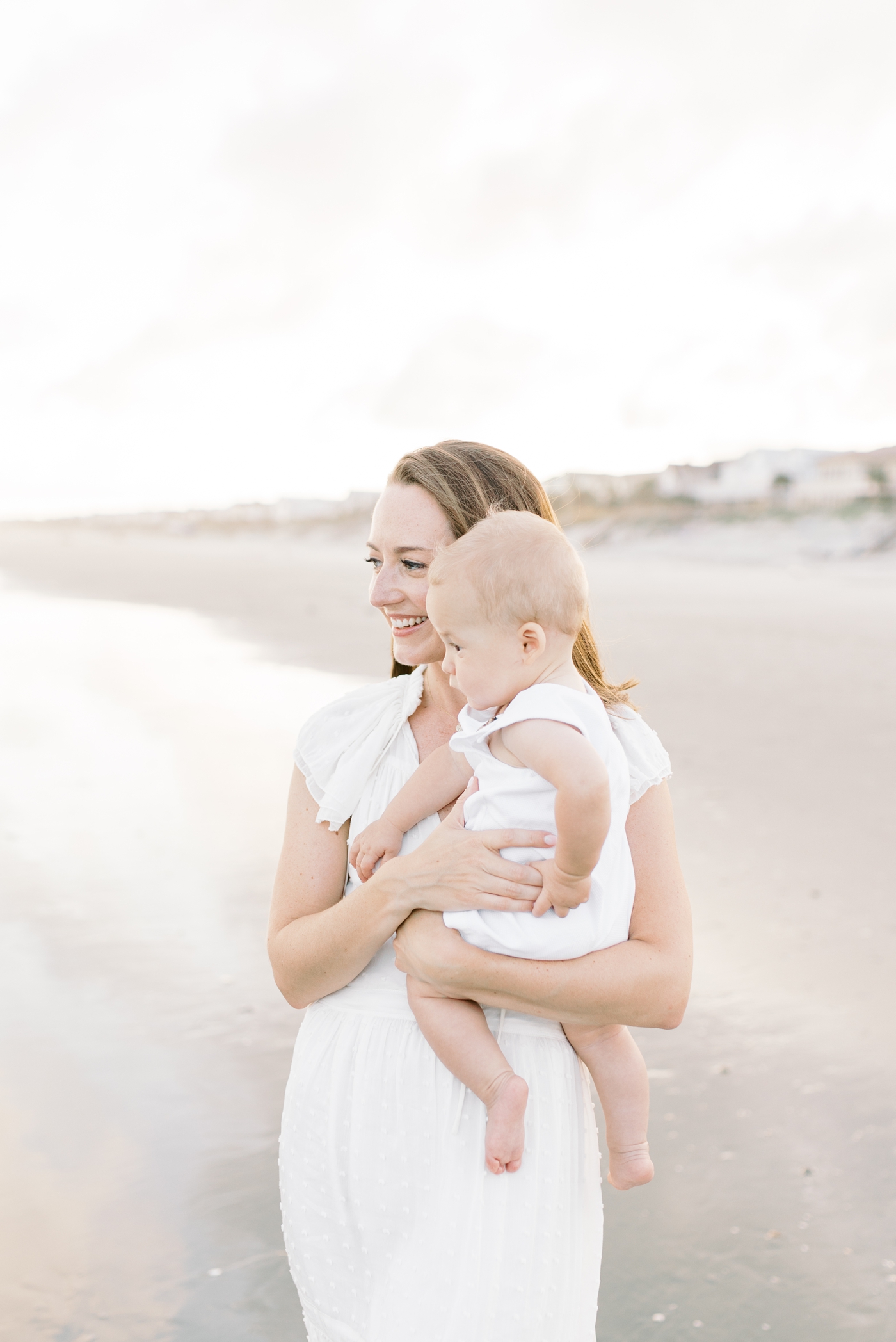 Mom holding her baby boy on the beach | Photo by Caitlyn Motycka Photography.
