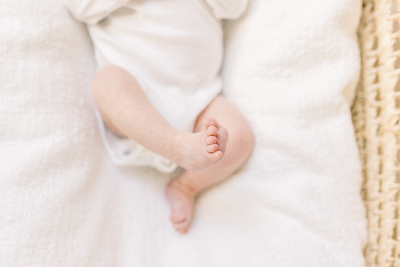 Detail of baby's foot during newborn session | Photo by Caitlyn Motycka Photography.