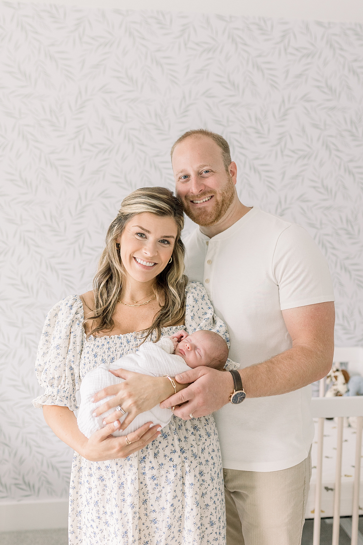 Mom and dad smiling holding their new baby | Baby Boy Newborn Photos CHS by Caitlyn Motycka Photography