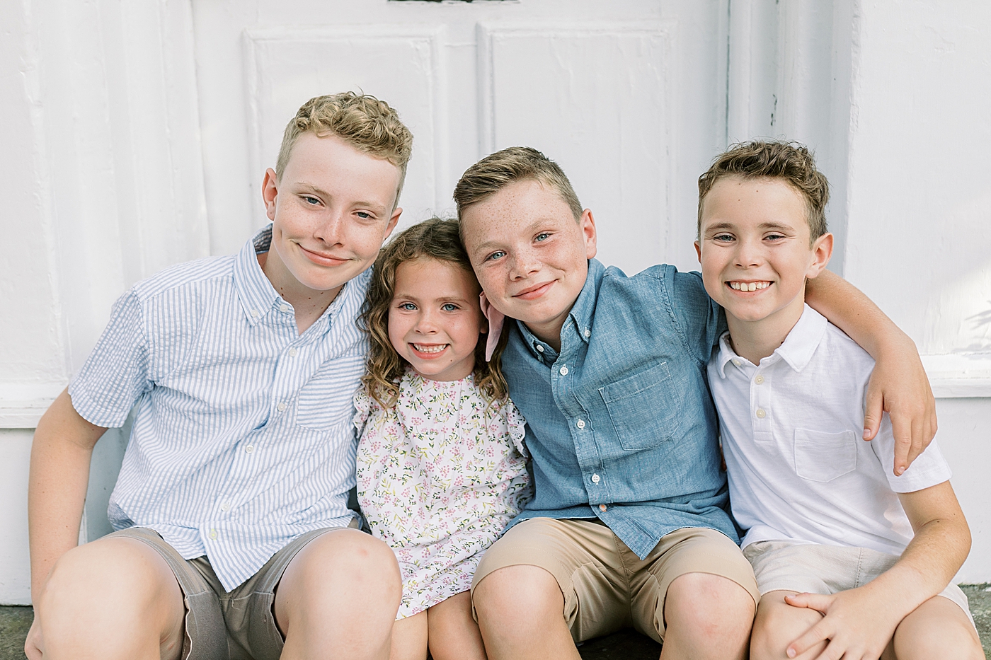 Siblings hugging during family photos | Photos by Family Photographer in Downtown Charleston