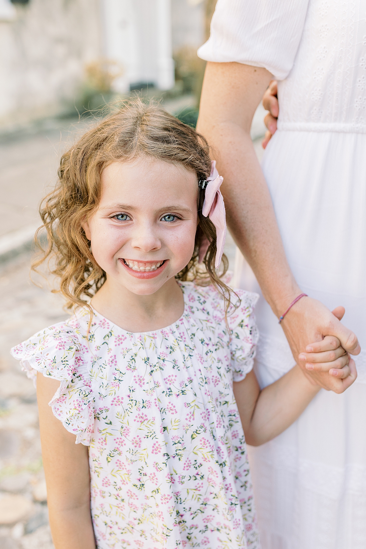 Little girl holding her mom's hand | Photo by Caitlyn Motycka Photography