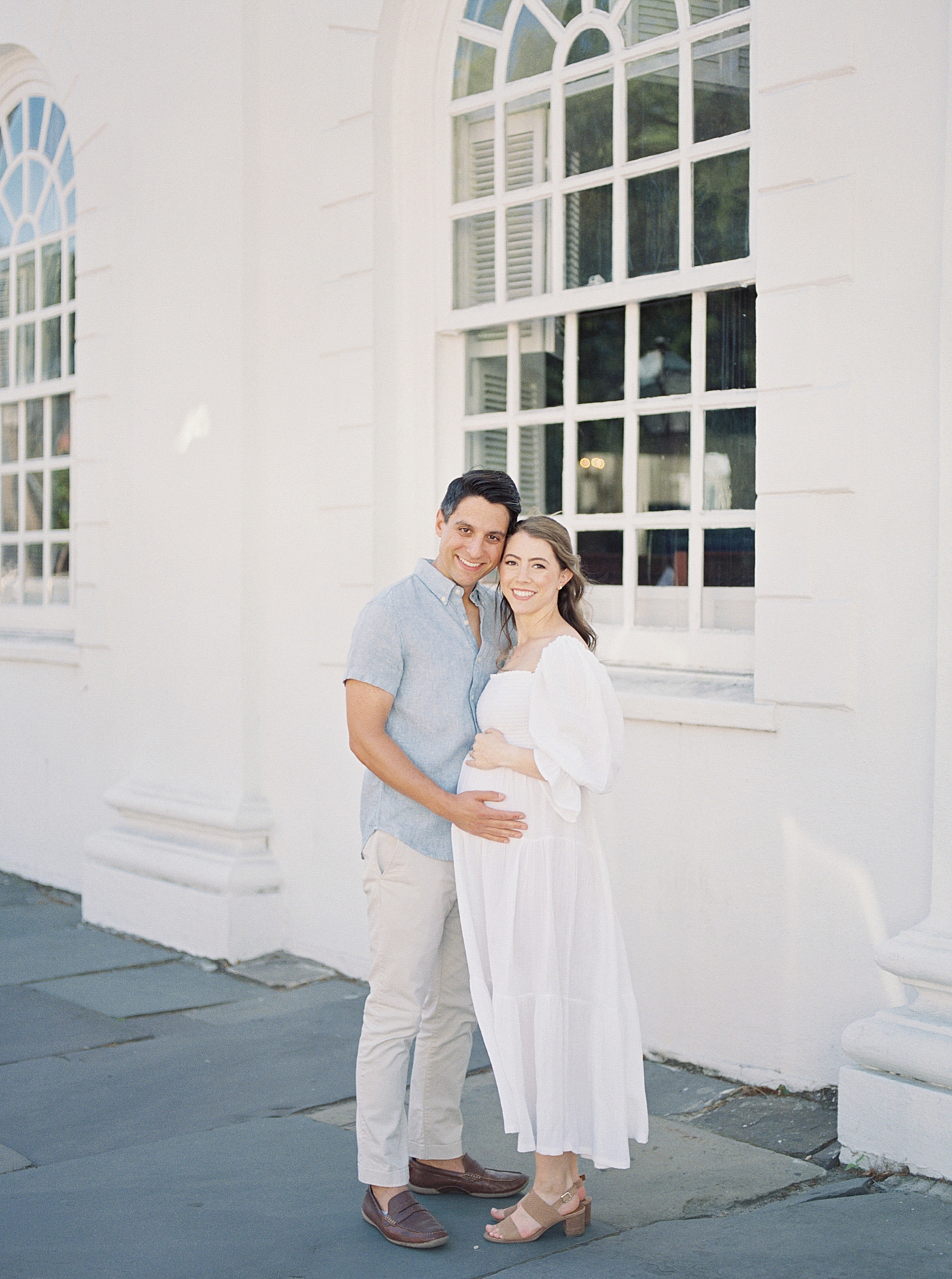 Mother and father to be snuggling together | Photo by Charleston Film Photographer Caitlyn Motycka