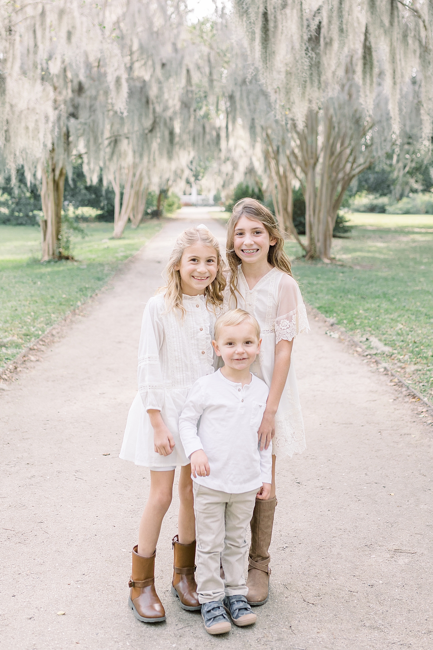 Three siblings in Hampton Park | Photo by Caitlyn Motycka Photography