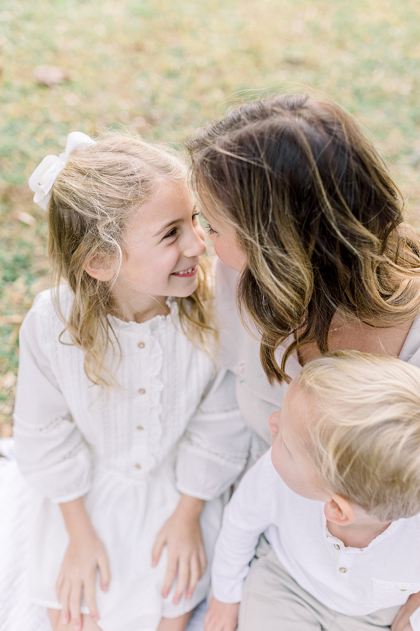 Mom and daughter nose to nose during their Fall Family Photos in Charleston | Photo by Caitlyn Motycka Photography