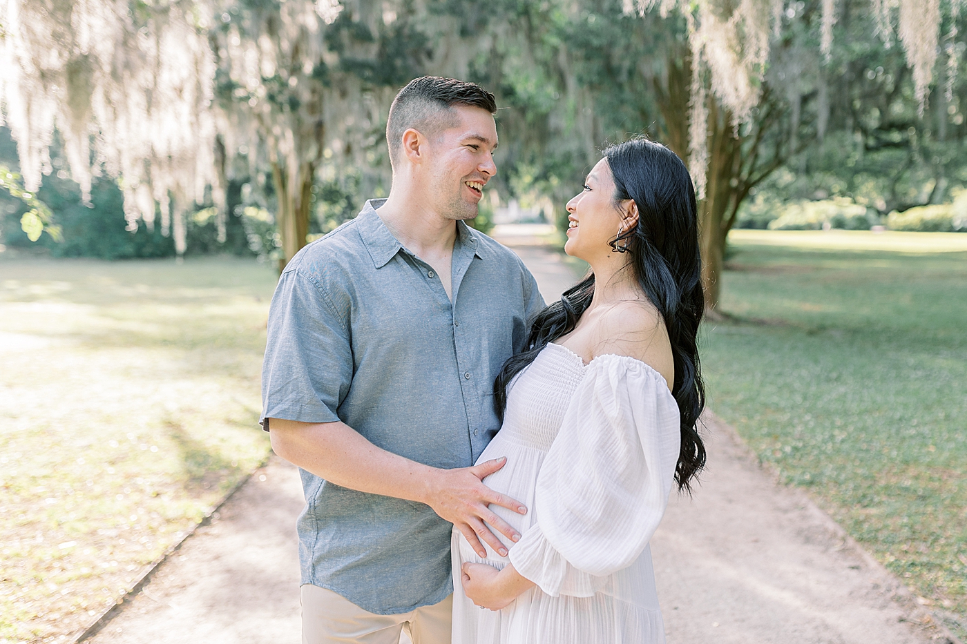 Mother and father to be laughing | Photo by Caitlyn Motycka Photography