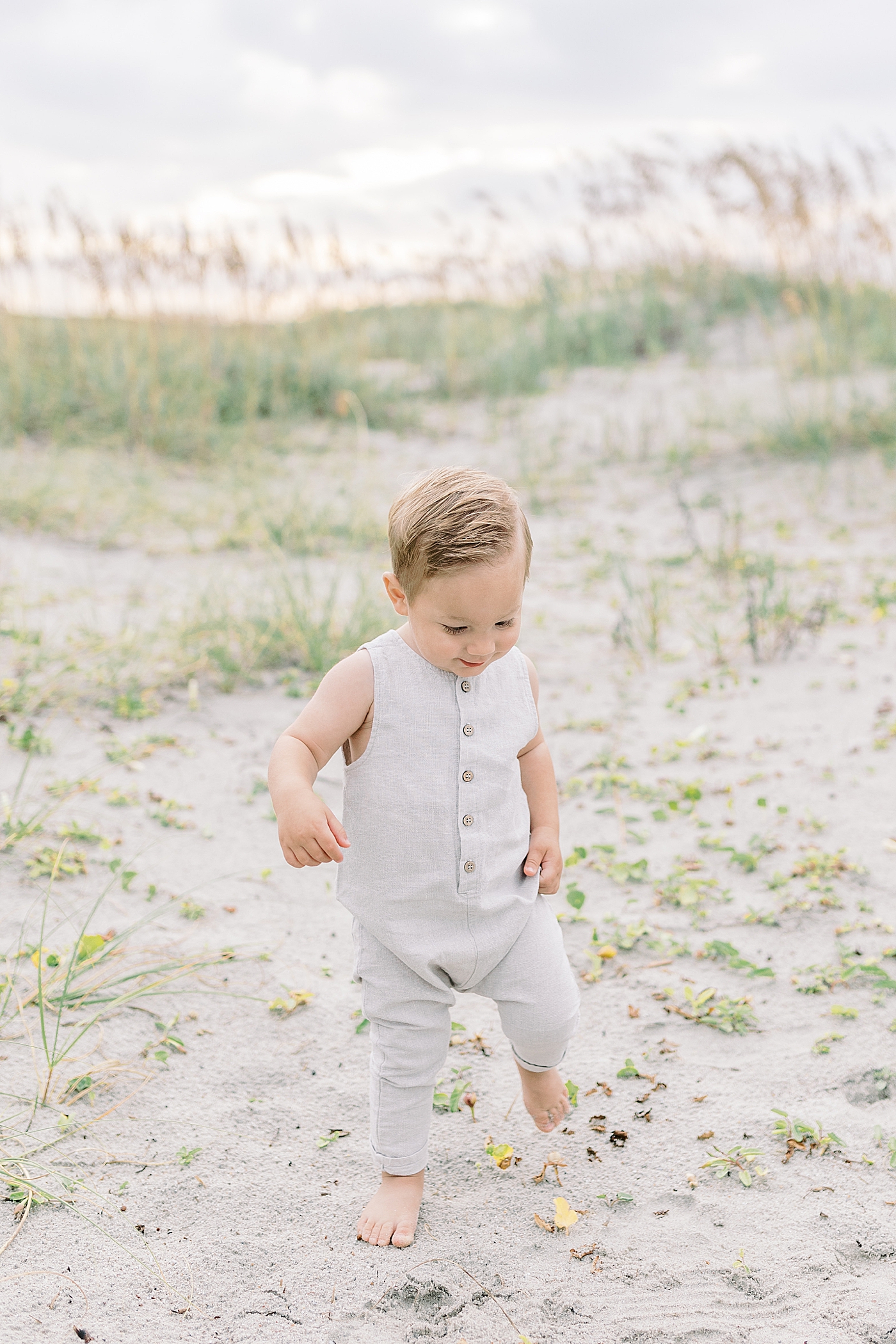 Baby boy walking on the beach | Preparing for Family Beach Session with Caitlyn Motycka