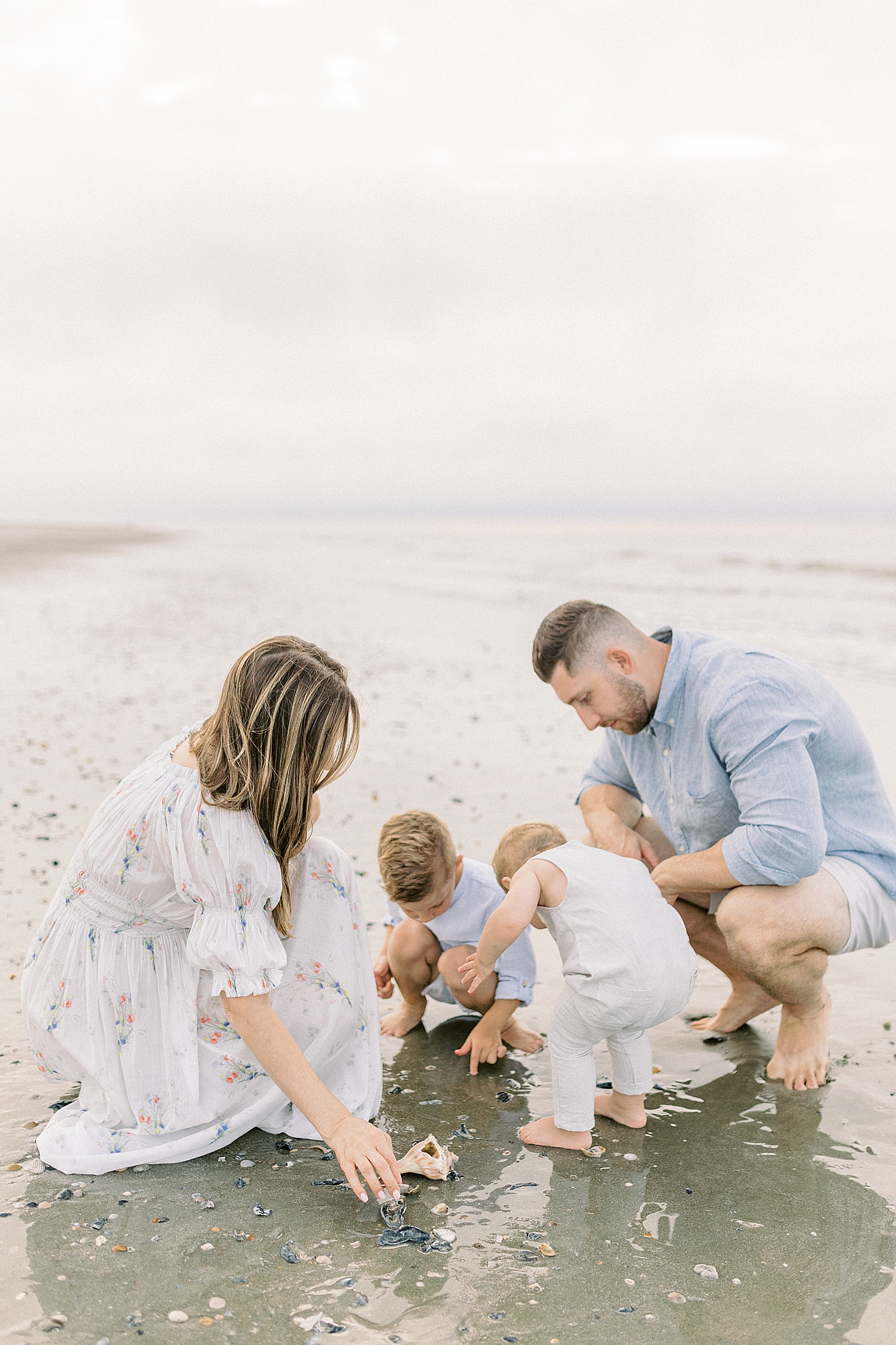 Family of four searching for shells | Image by Caitlyn Motycka